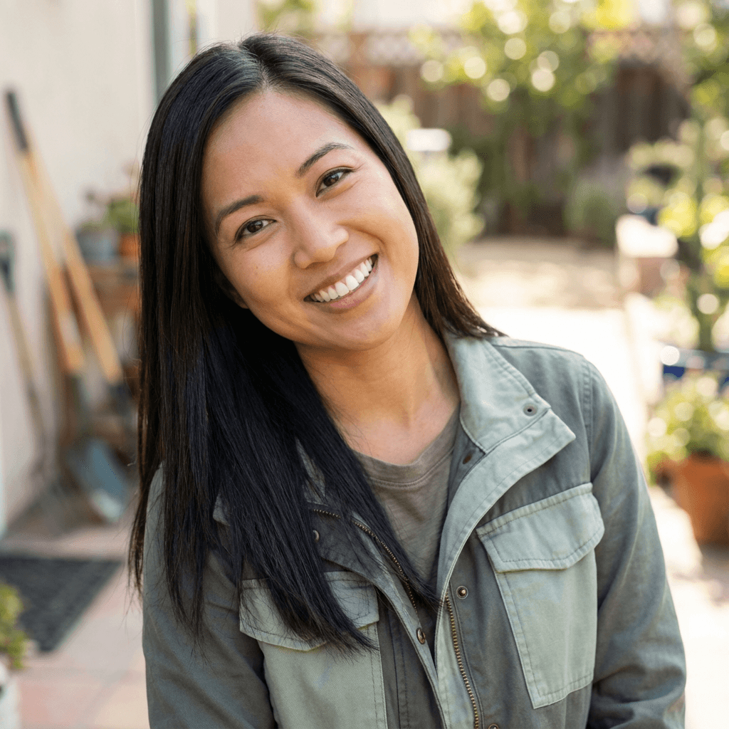 Female homeowner in her mid 30s, White, friendly smile by clean gutters